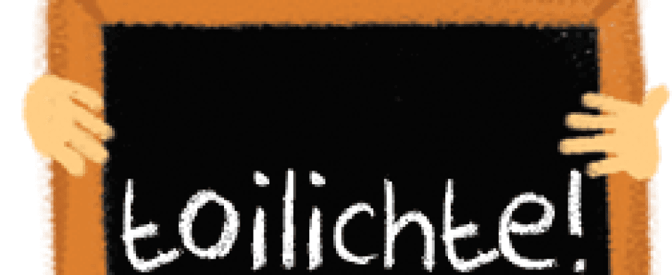 Boy holding blackboard with text Toilichte (Happy)
